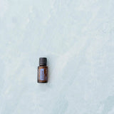dōTERRA ZenGest 15ml ätherisches Öl auf blauem Marmor | doTERRA