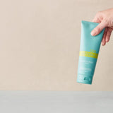 dōTERRA SPA Hand- und Körperlotion – Flasche mit Hand | doTERRA