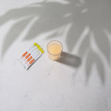 dōTERRA MetaPWR Advantage Sachets im Gefäß mit orangem Marmor und Palme | doTERRA