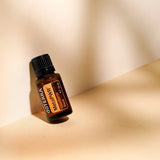 dōTERRA MetaPWR Mischung 15ml geneigte Flasche mit warmem Licht | doTERRA