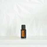 dōTERRA MetaPWR Mischung 15ml im weißen Regal mit Palmenschatten | doTERRA