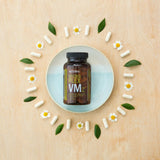 dōTERRA Microplex VMz Nahrungsergänzung – blauer Teller mit Kapseln und Blumen Aufsicht | doTERRA