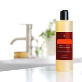 dōTERRA On Guard Reiniger 355ml – Studio mit Wasserhahn und Pflanze | doTERRA