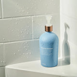 dōTERRA Schutz-Shampoo 500ml weiße Flasche auf Theke | dōTERRA Haarpflege Shampoo