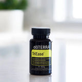 dōTERRA TriEase Nahrungsergänzung 60ct Flasche auf schwarzer Theke mit Pflanze | doTERRA