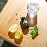 dōTERRA TriEase Nahrungsergänzung 60ct Flasche mit Zitrone, Minze und Eis auf Holz | doTERRA